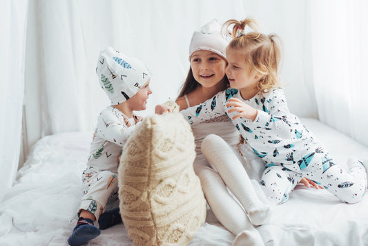 Group of friends having a fun and colorful pyjama party with laughter, snacks, and cozy sleepwear.